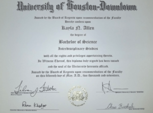 White Paper with Black Lettering Detailing the Bachelor Science obtained by KayLa N. Allen, and signed and sealed with a silver seal